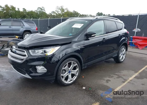 2017 Ford Escape Titanium z USA, uszkodzony, nr VIN 1FMCU0J95HUA75324